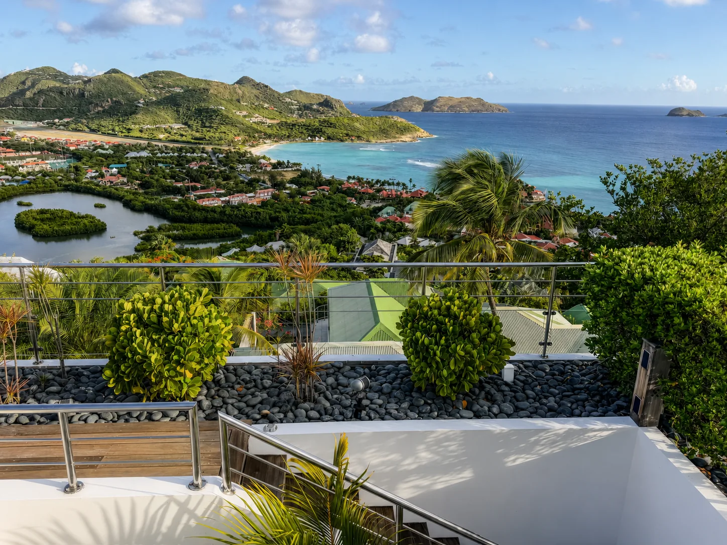 View from the villa terrace across St. Jean, the lagoon and the turquoise bay to the offshore islets